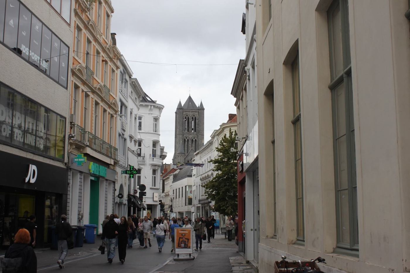 A church tower at the end of a street